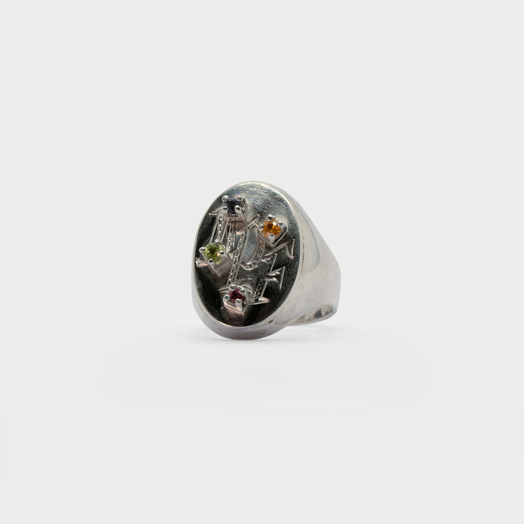 Engraved signet rign with found 4 prong settings.