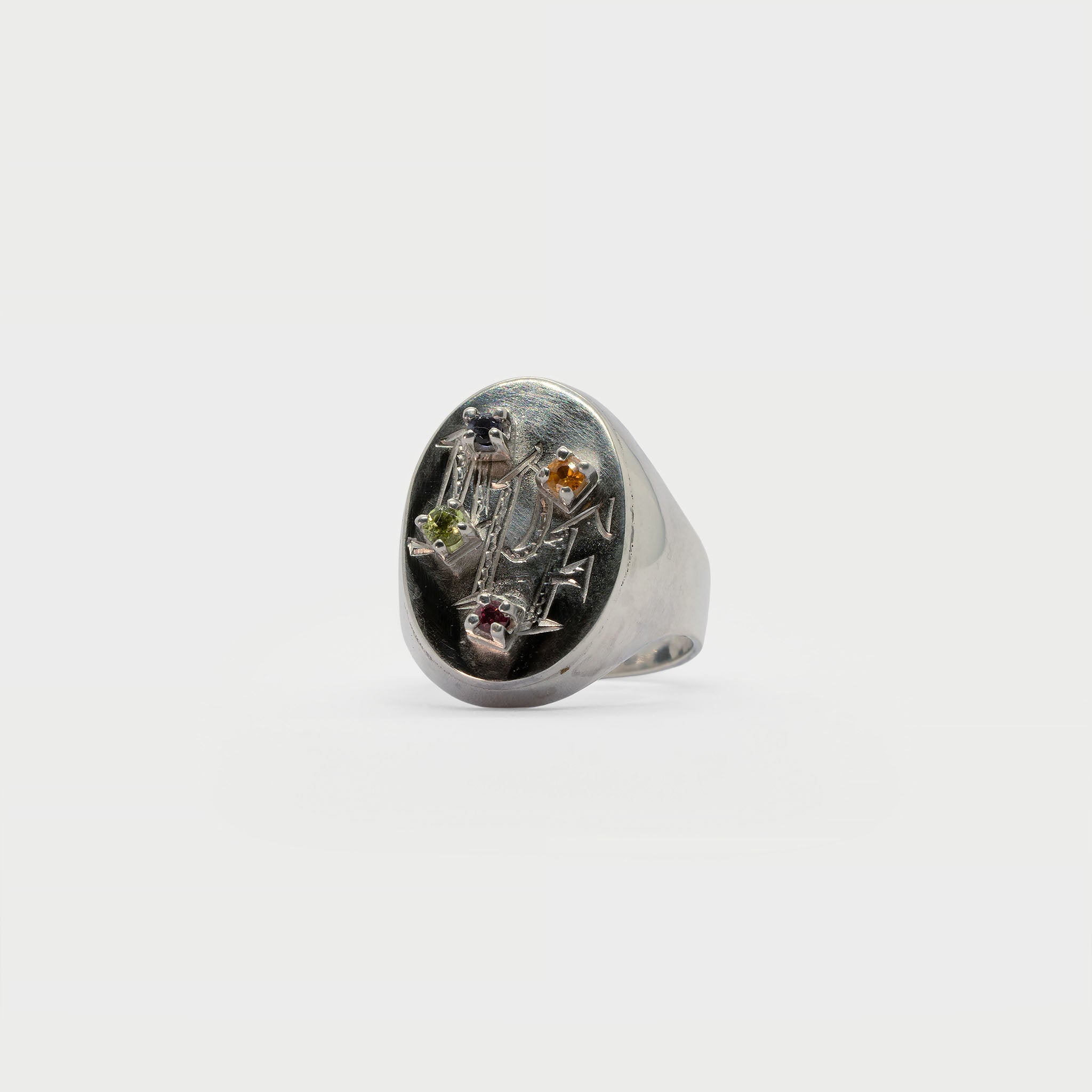 Engraved signet rign with found 4 prong settings.