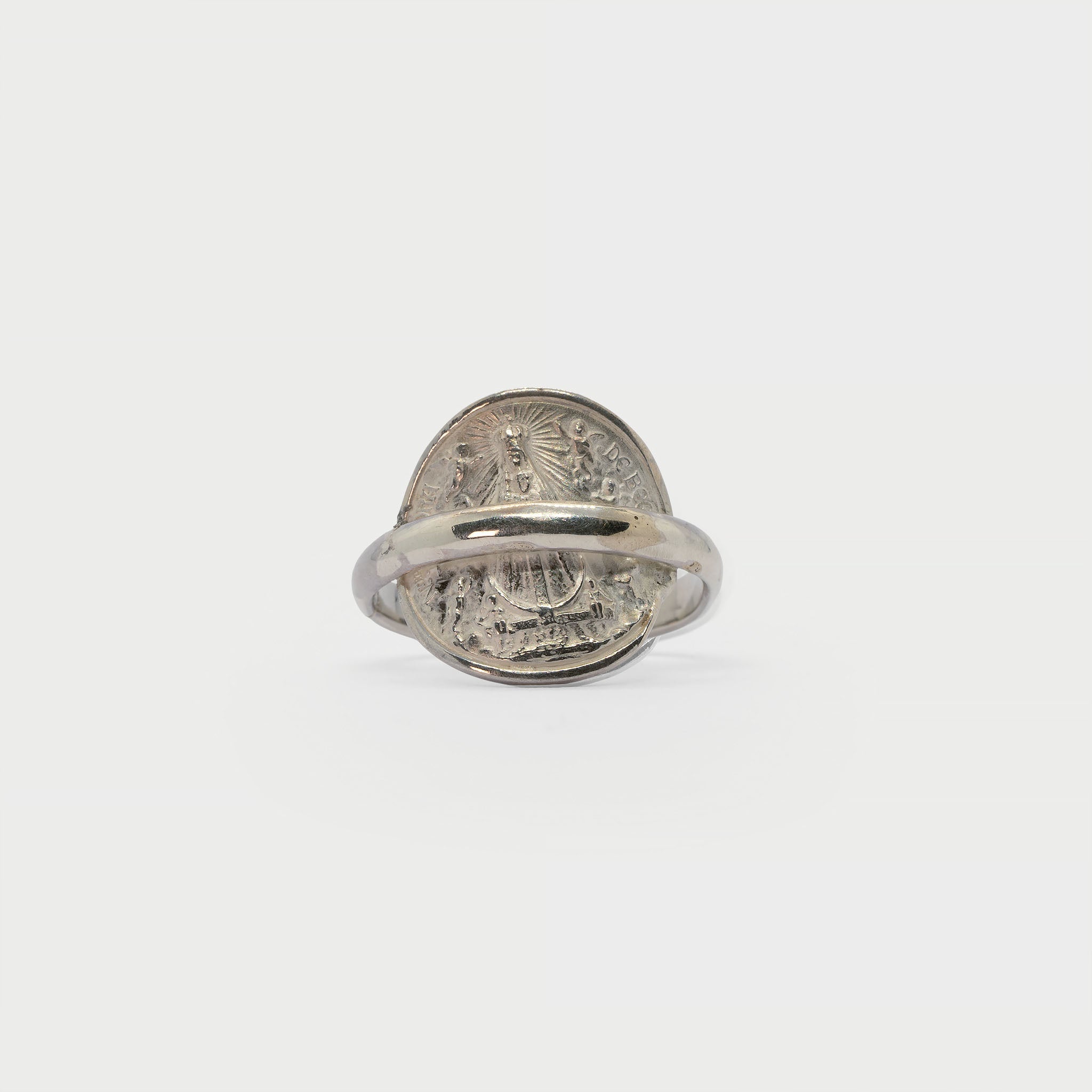 Found religious medal and ring band.
