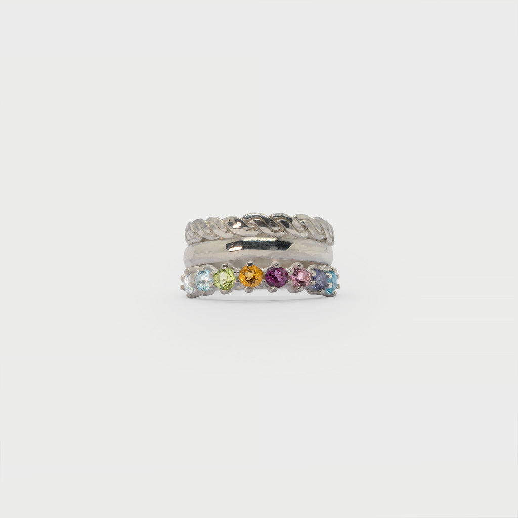 Two silver rings and a half eternity ring.
