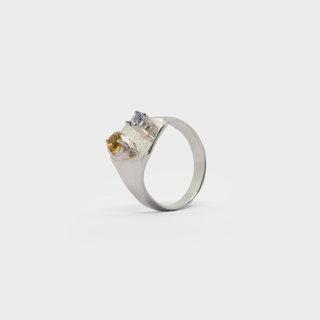 Engraved signet ring with two prong settings.