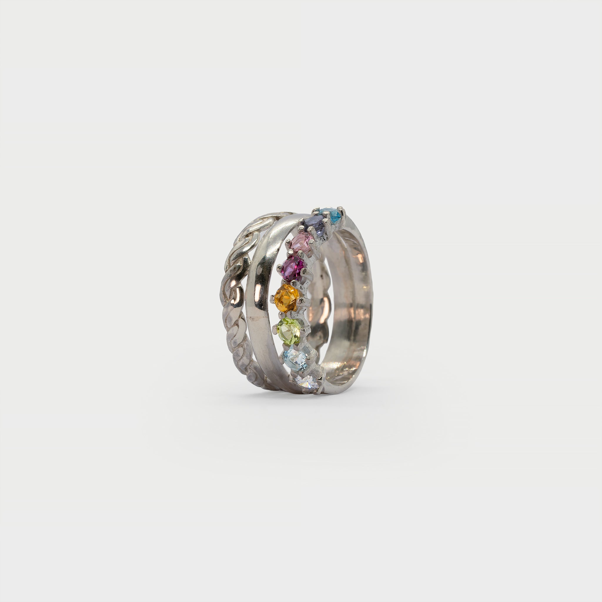 Two silver rings and a half eternity ring.