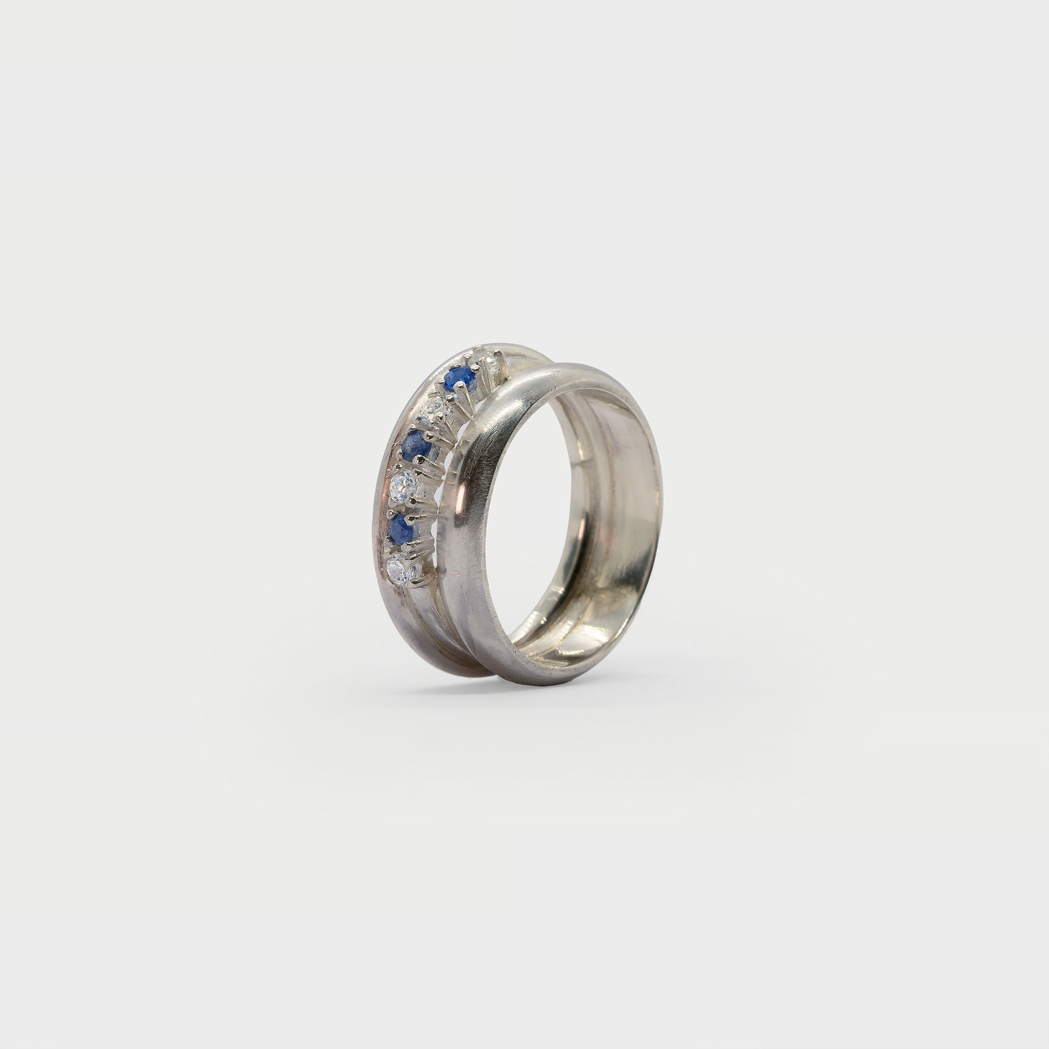 Two silver bands and a half eternity ring