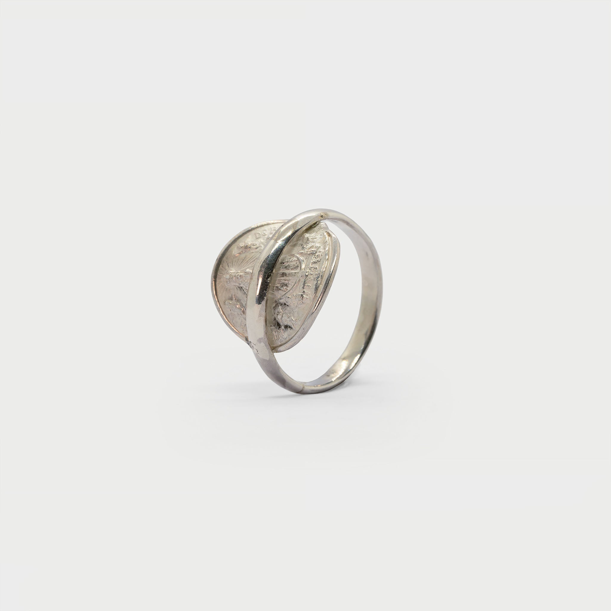 Found religious medal and ring band.