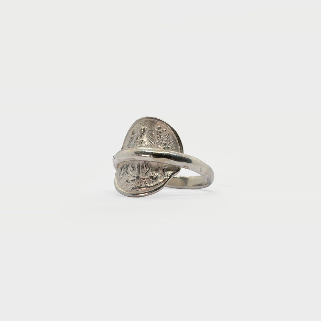 Found religious medal and ring band.