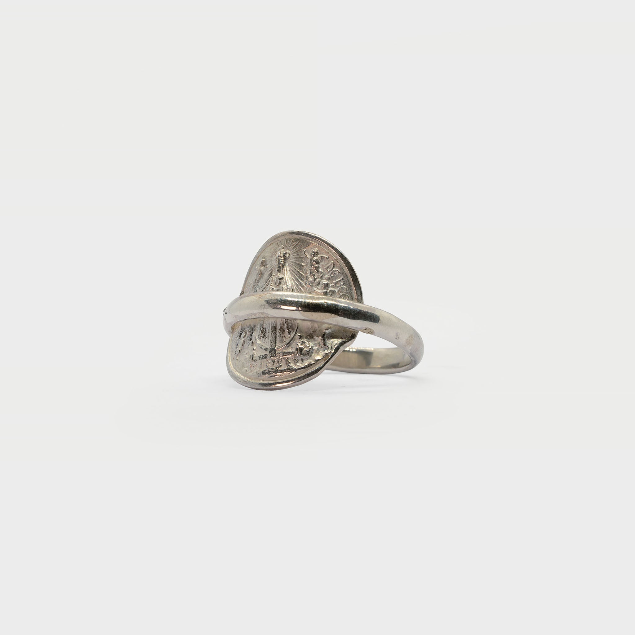 Found religious medal and ring band.