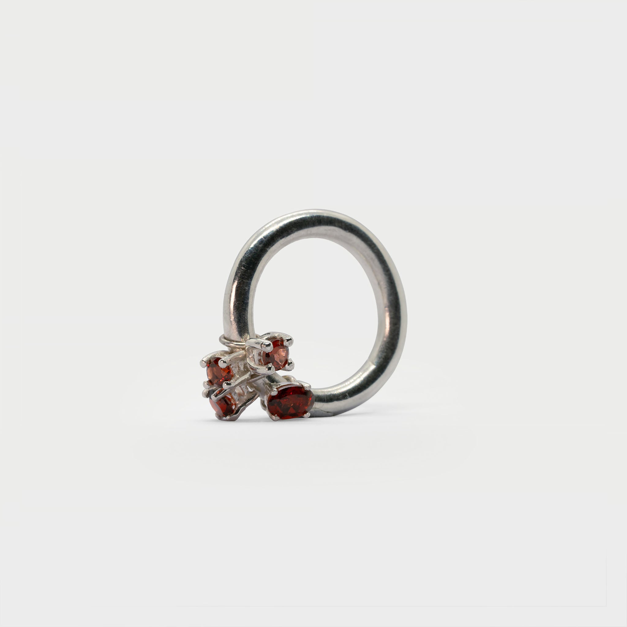 Sterling silver ring band with 4 found prong settings.