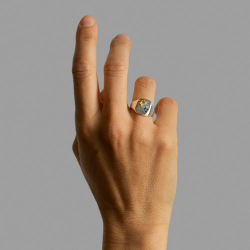 Engraved signet ring with two prong settings.