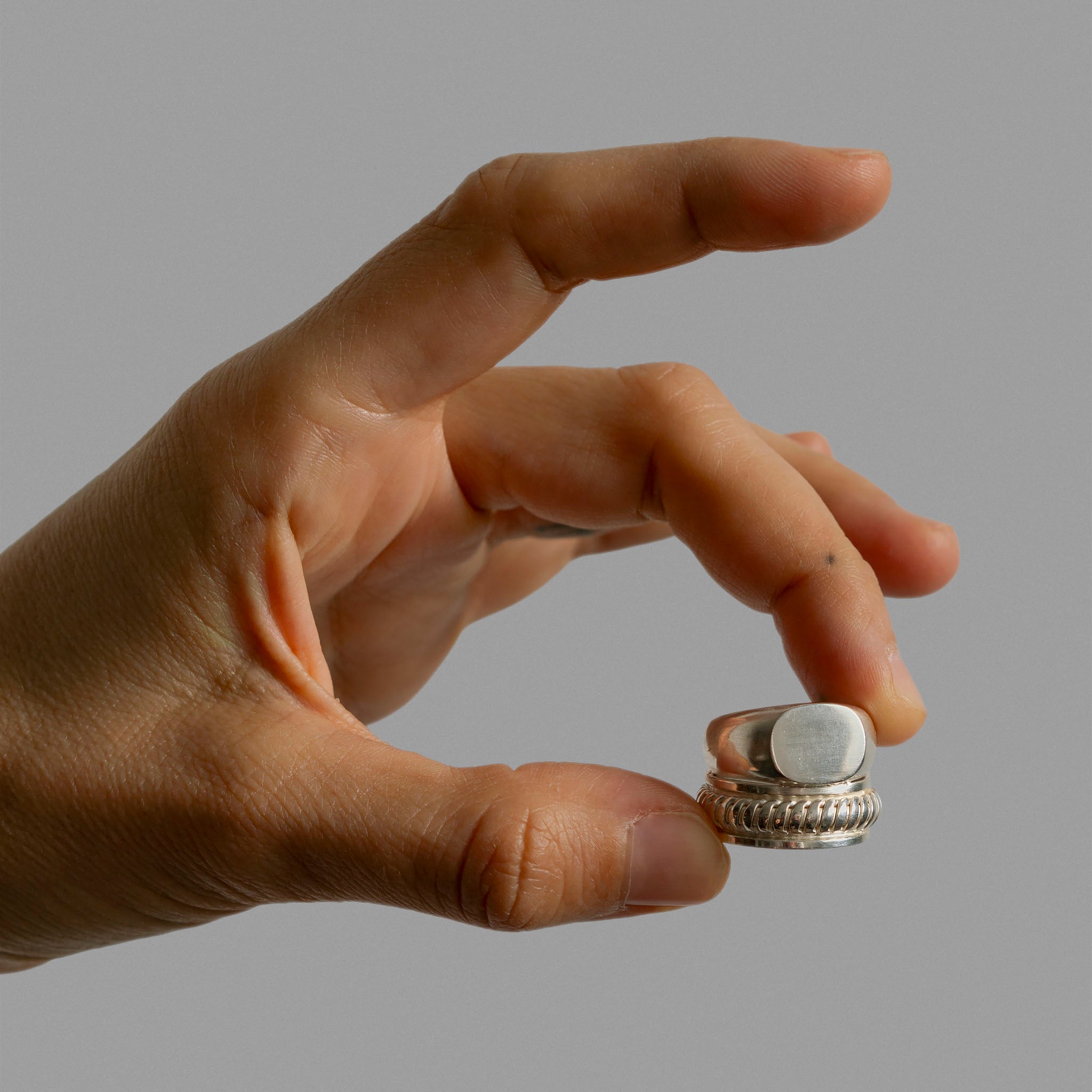 Signet ring and two overlaped ring bands.