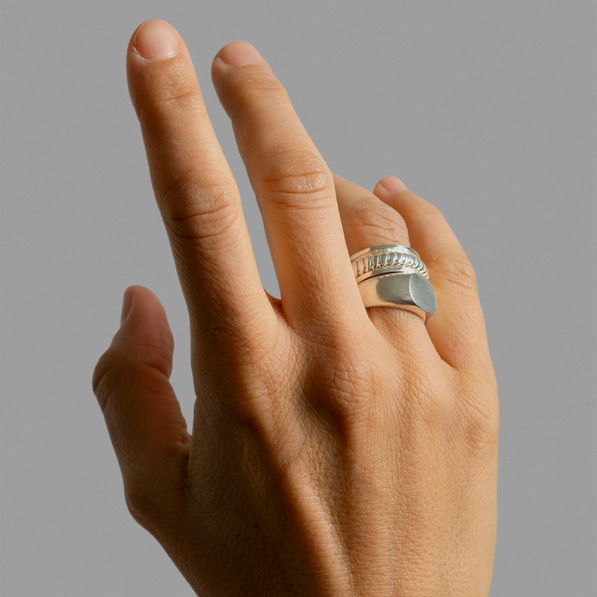 Signet ring and two overlaped ring bands.