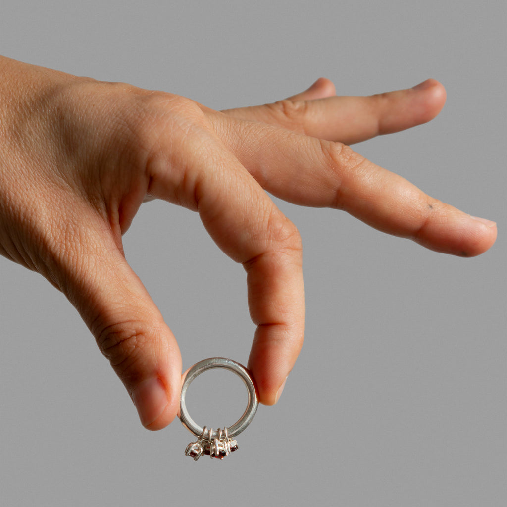 Sterling silver ring band with 4 found prong settings.