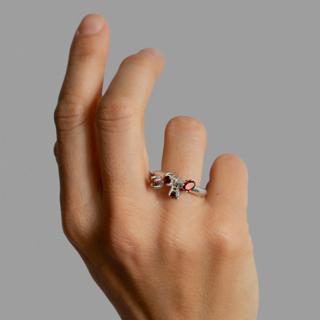 Sterling silver ring band with 4 found prong settings.