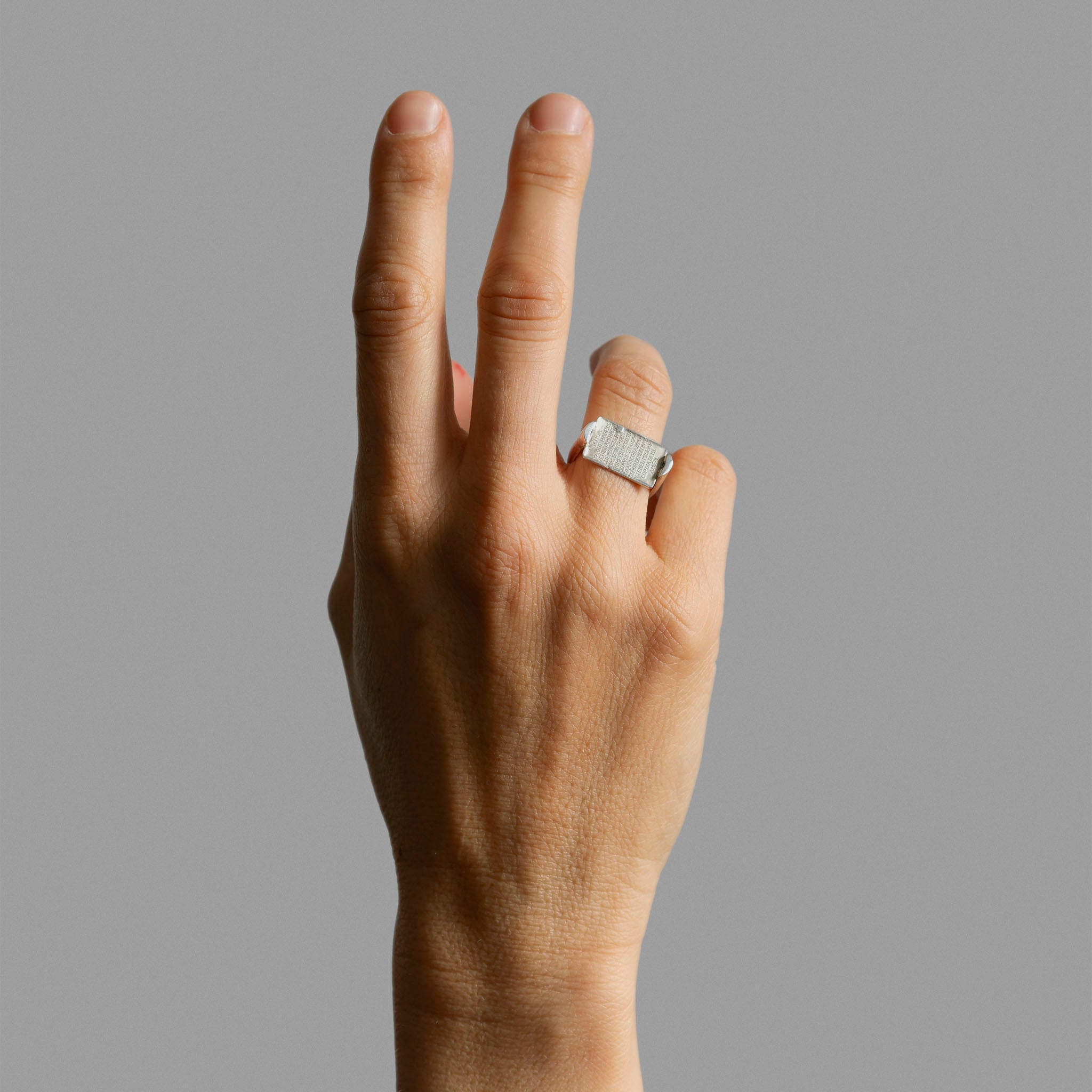 Sterling silver ring with medal.