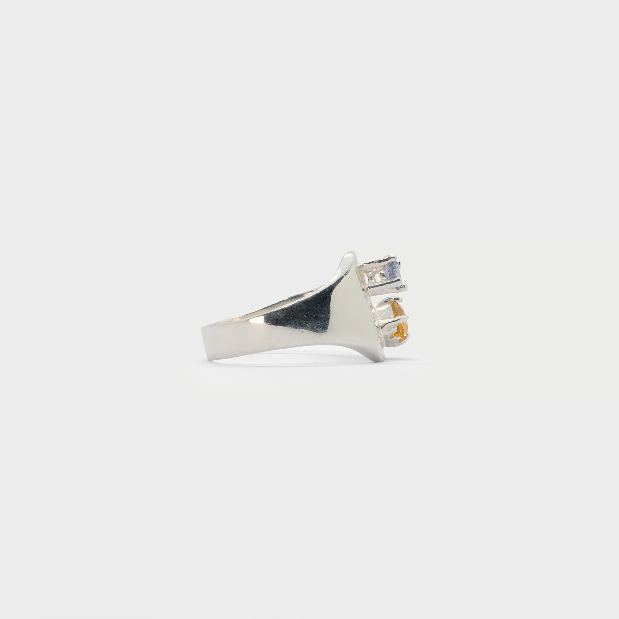 Engraved signet ring with two prong settings.