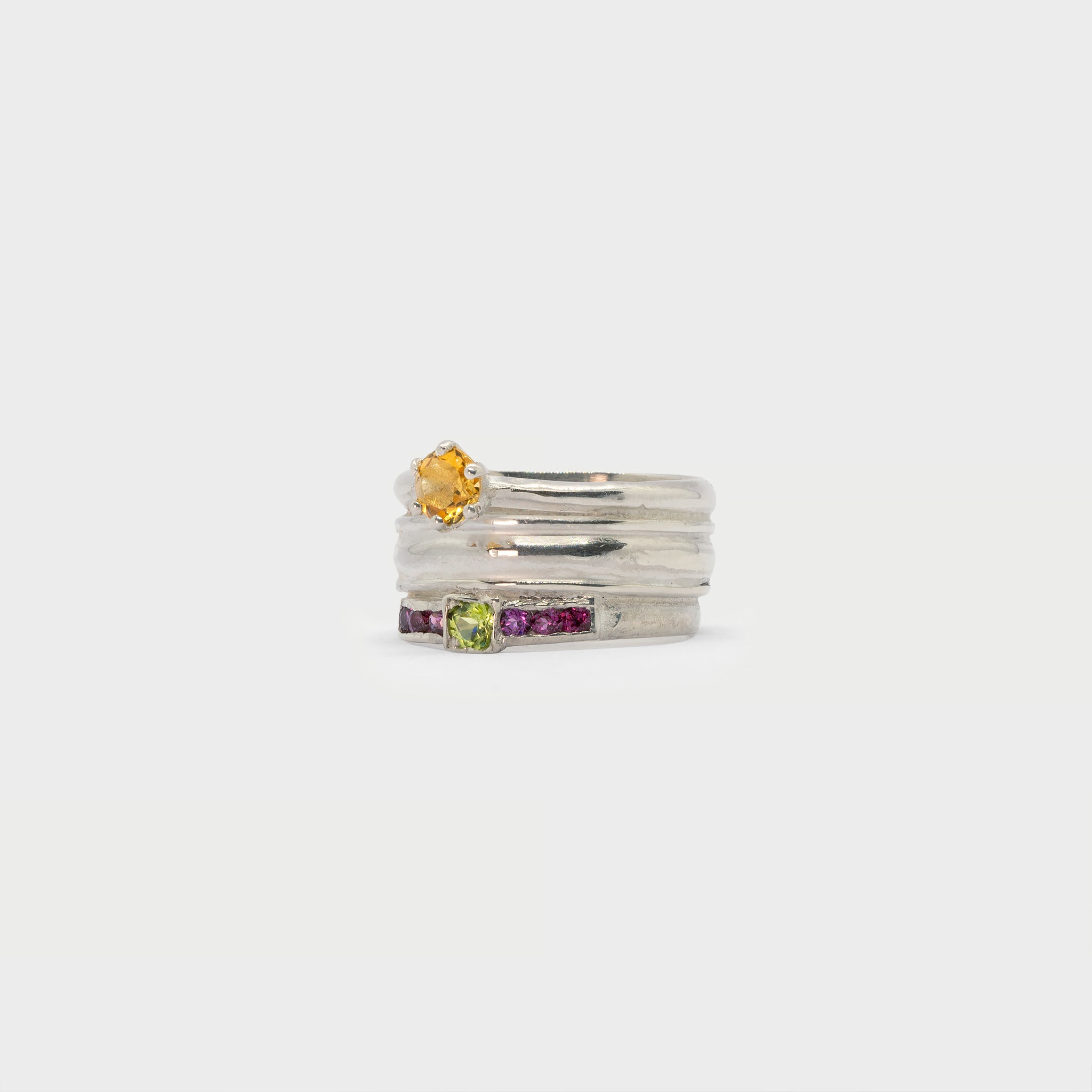 Found solitaire ring, ring band and a side-stone solitaire ring