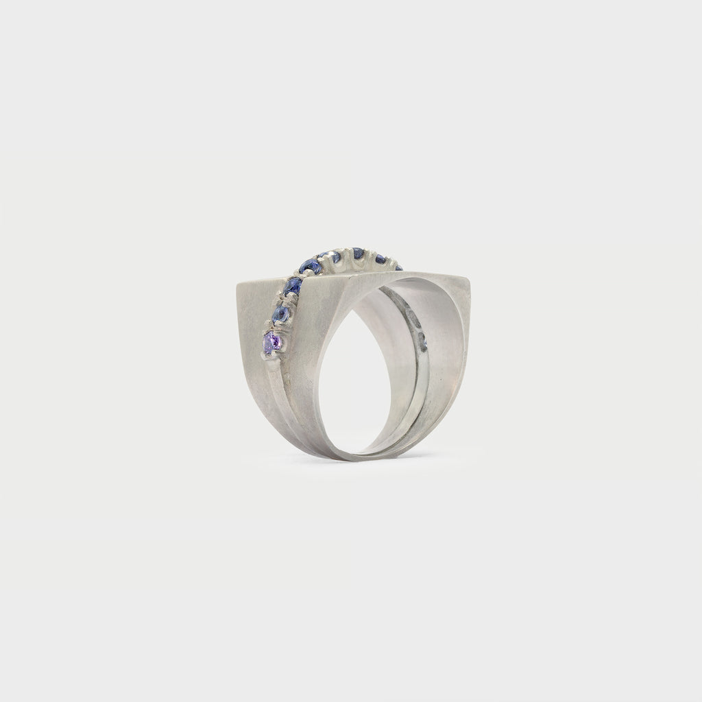 Two half signet rings and one half-eternity band. 11 iolites.