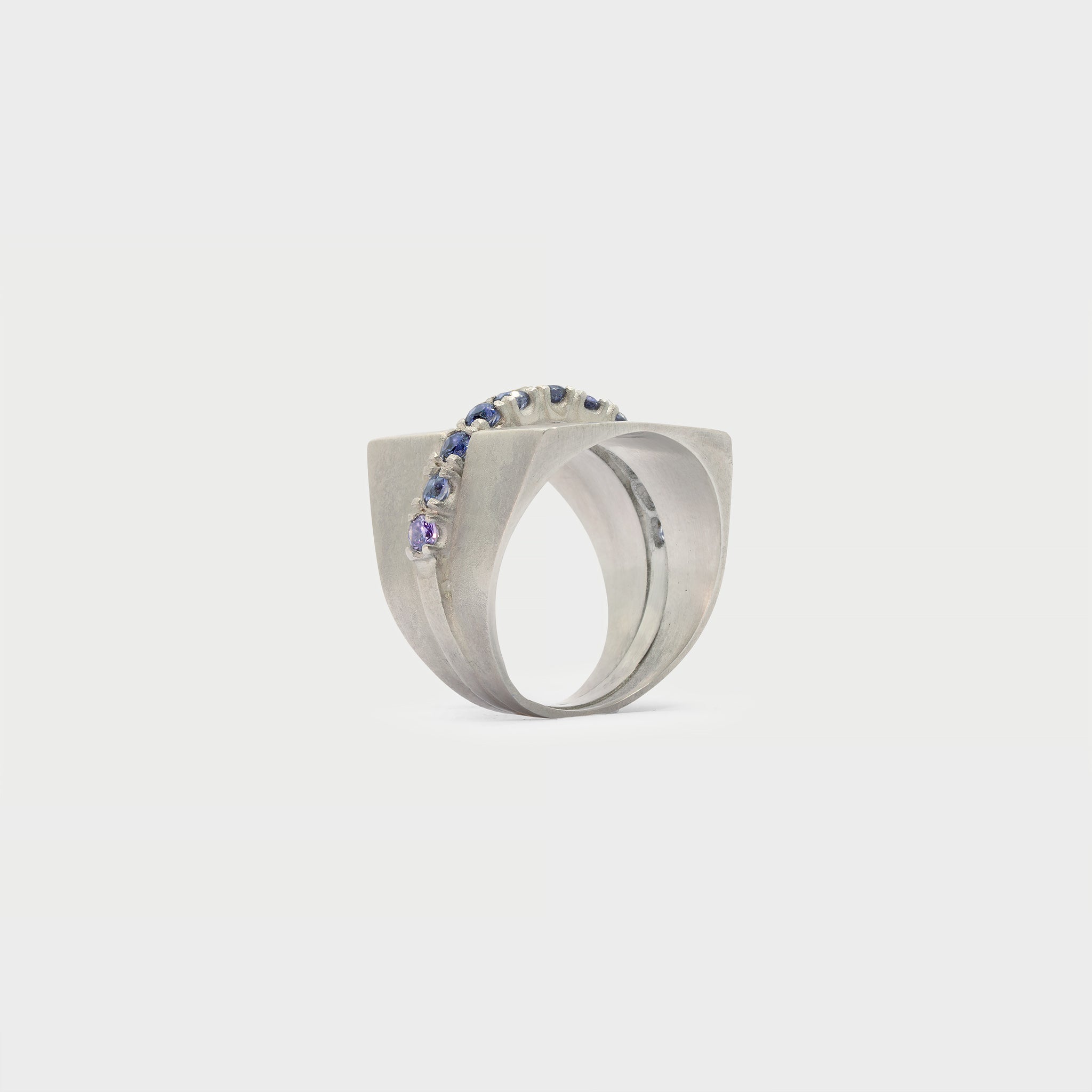 Two half signet rings and one half-eternity band. 11 iolites.