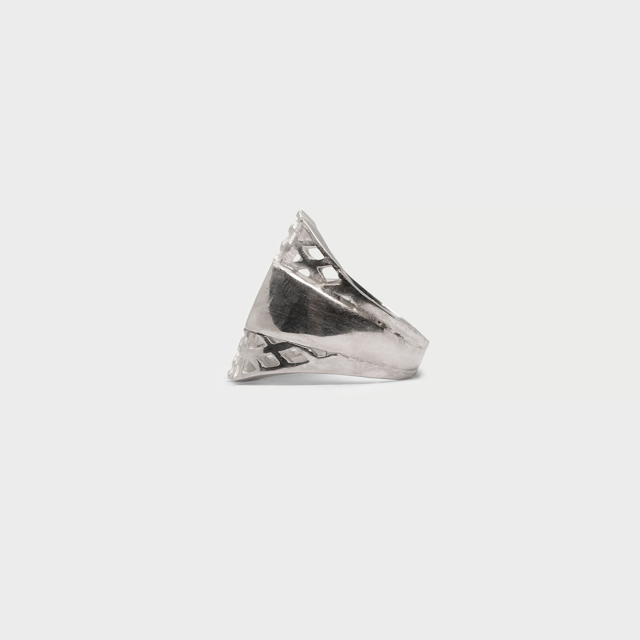 Two halfs of a signet ring and a signet ring.