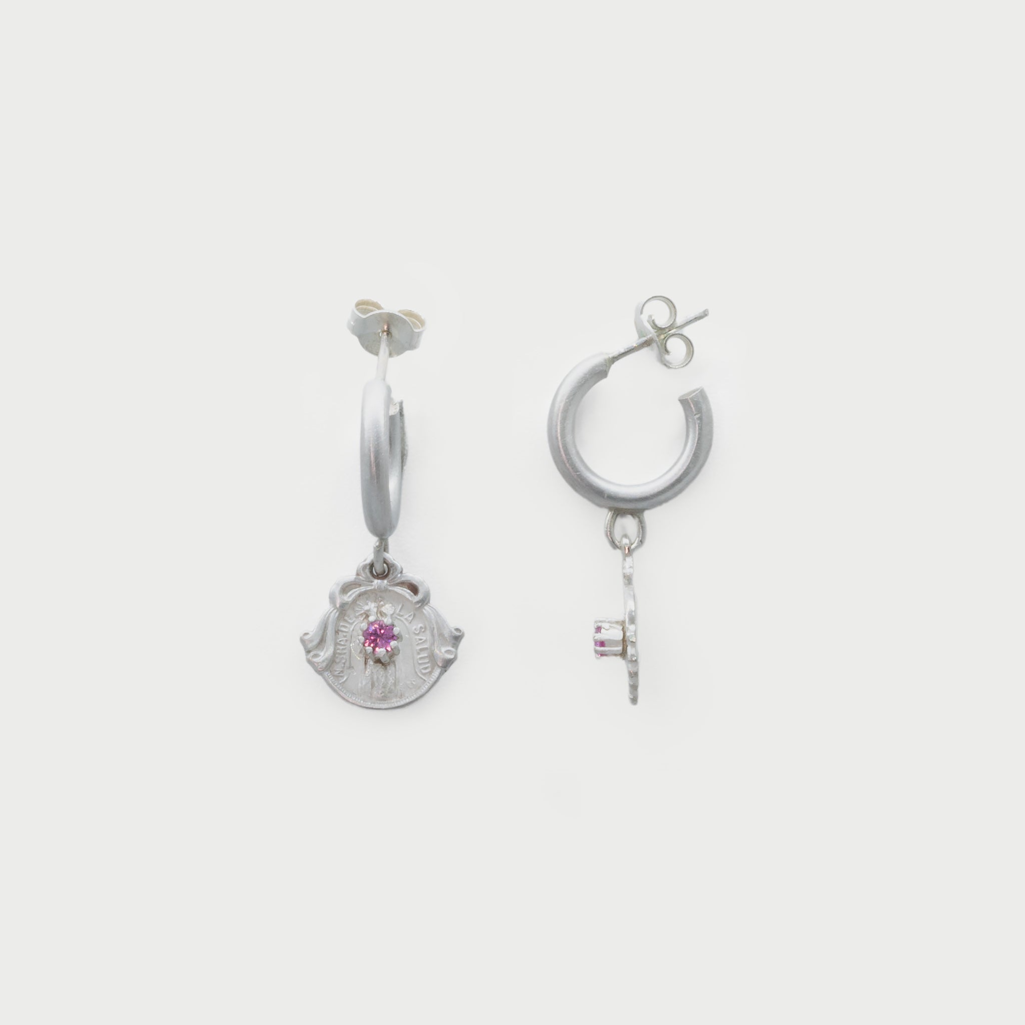 Hoop with medals and pink saphire.