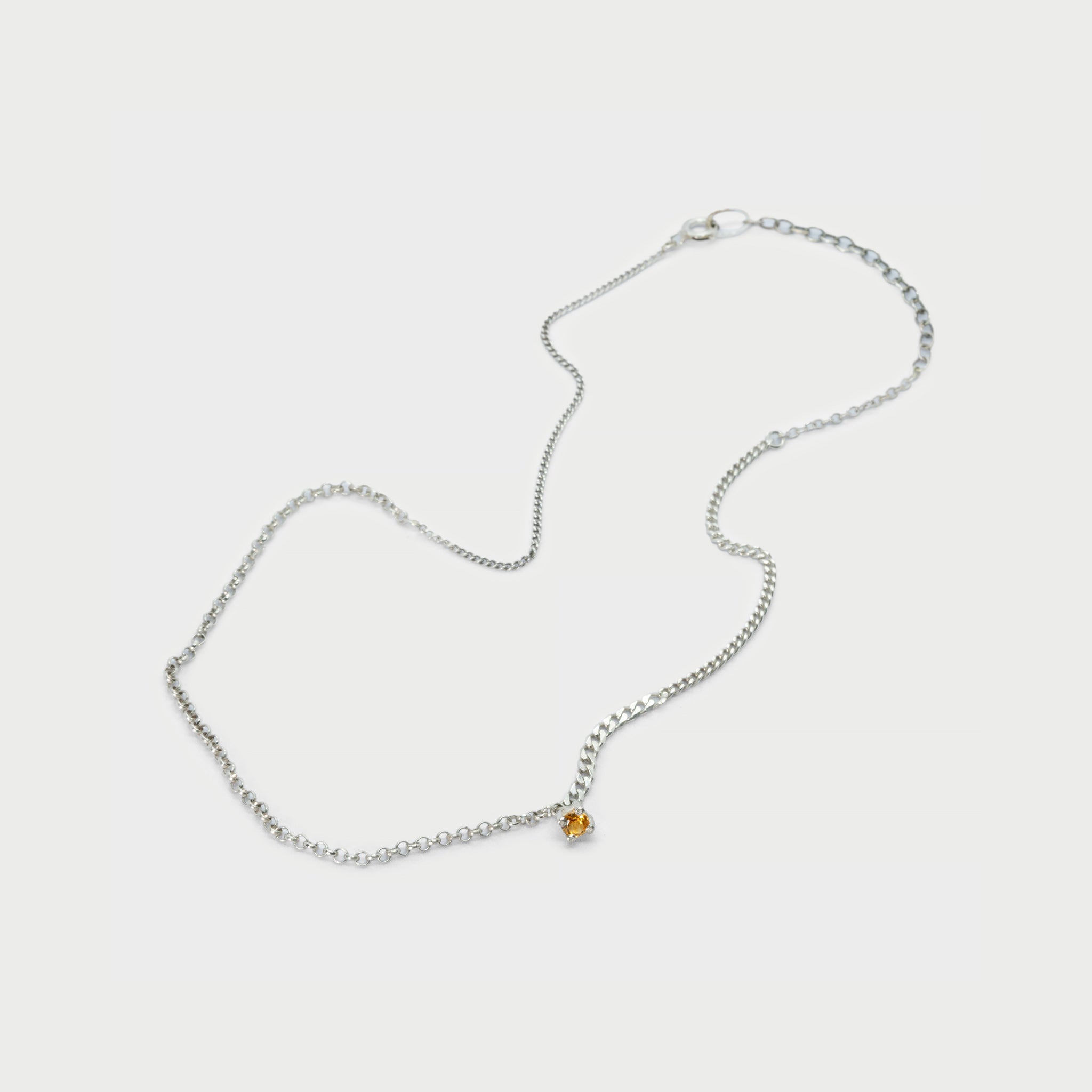 Broken chain pieces with 4 prong setting and citrine.