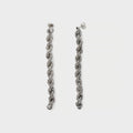 Long rope chain earring.
