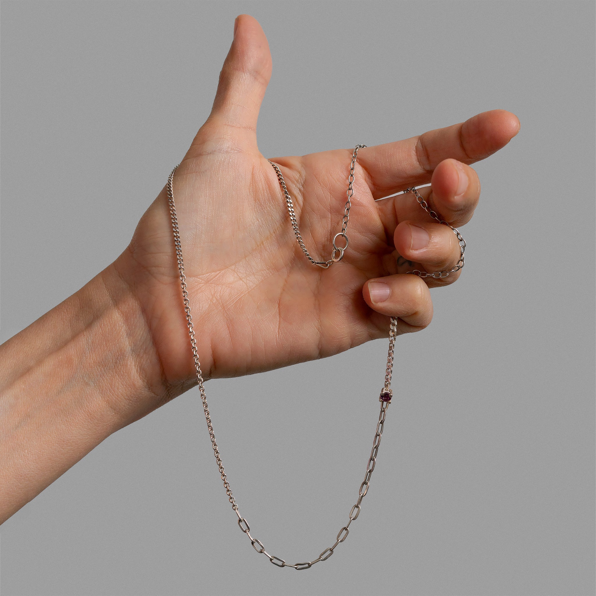 Necklace made of broken chain pieces