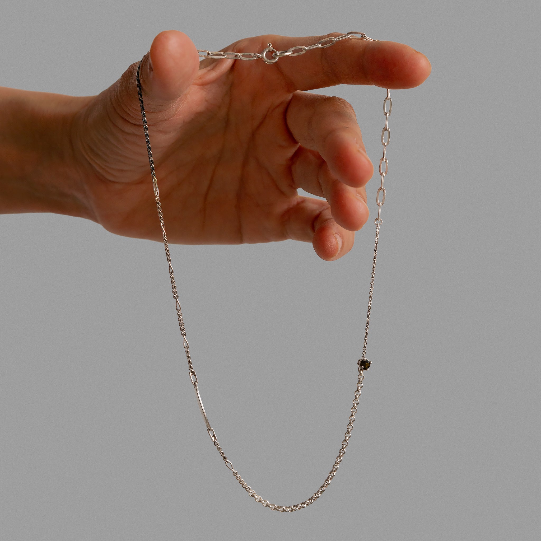 Necklace made of broken chain pieces and 'no me olvides' bracelet.