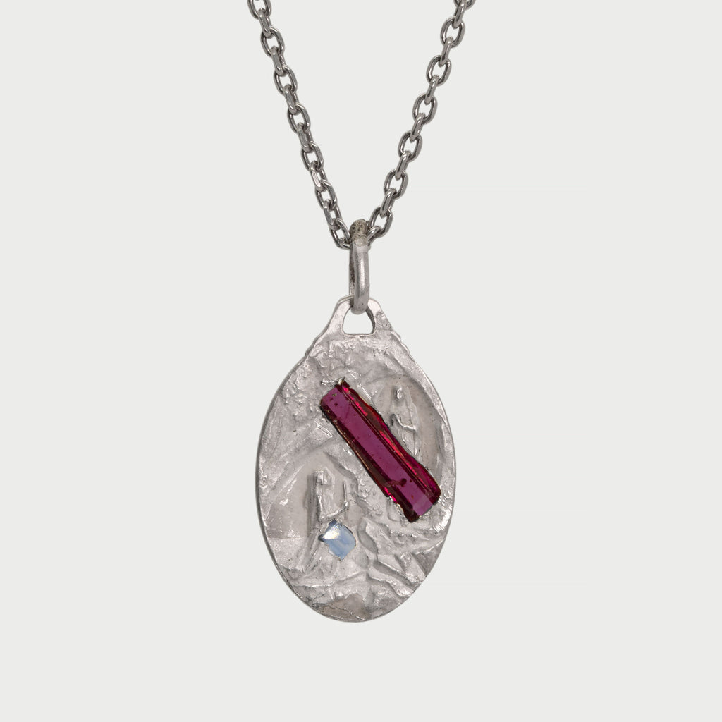 Found silver medal with stones