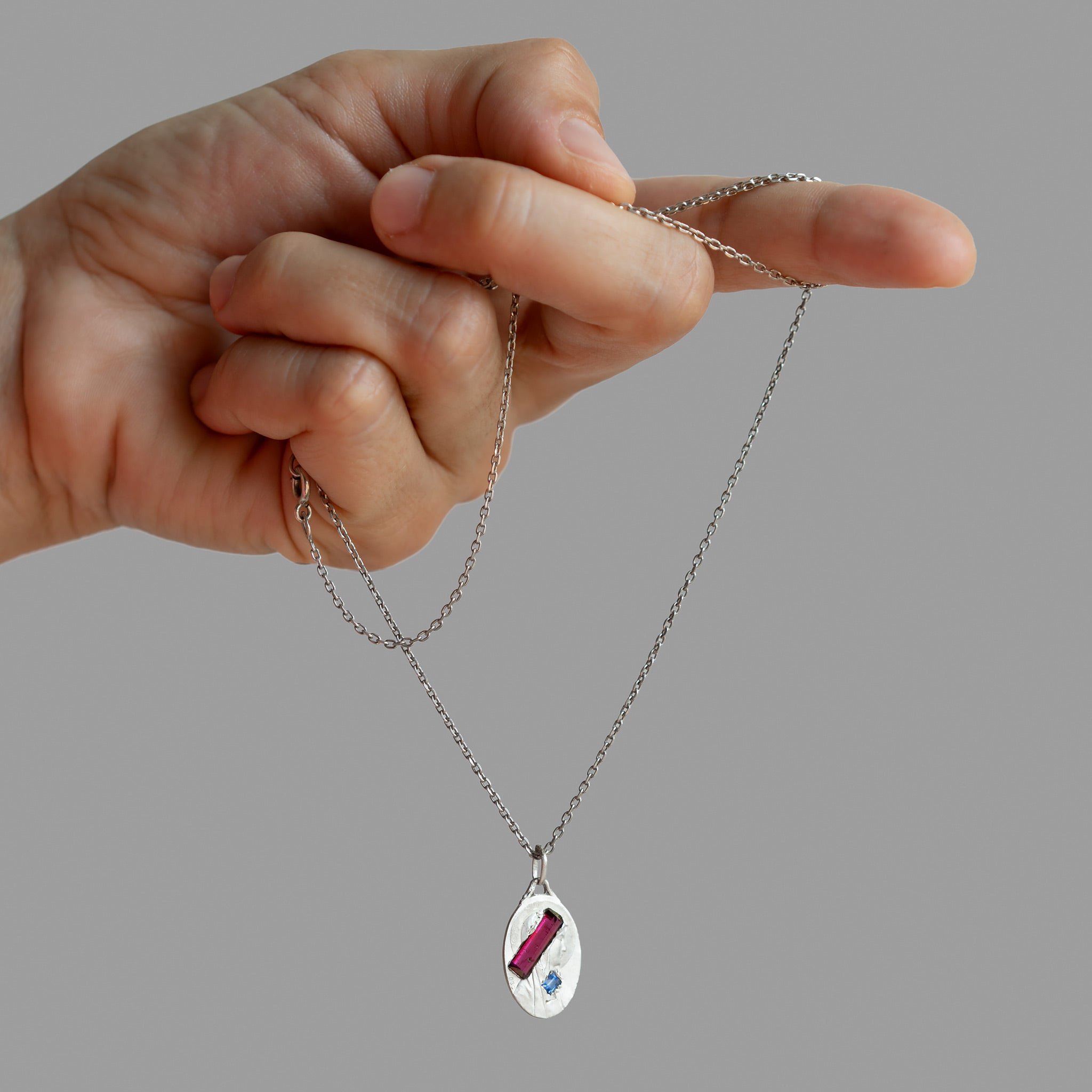 Found silver medal with stones