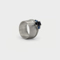Wide band and solitaire with side sapphires ring